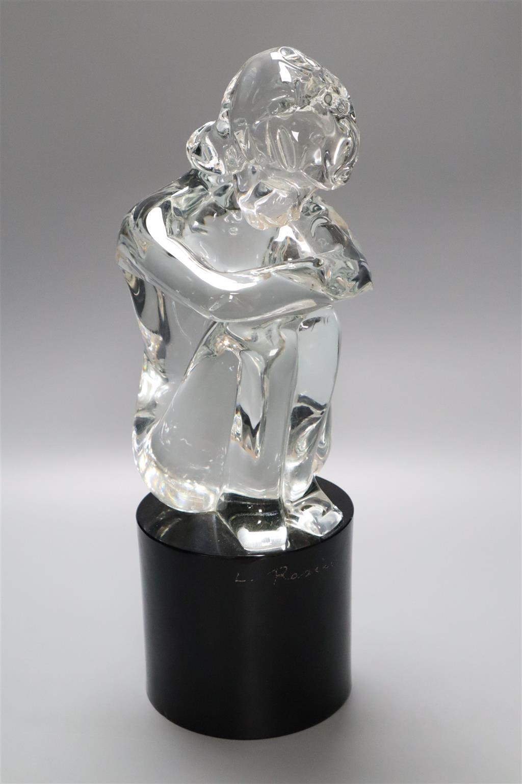 A Murano glass sculpture of a female seated on a black cylindrical glass plinth, signed L. Rosici, 38cm